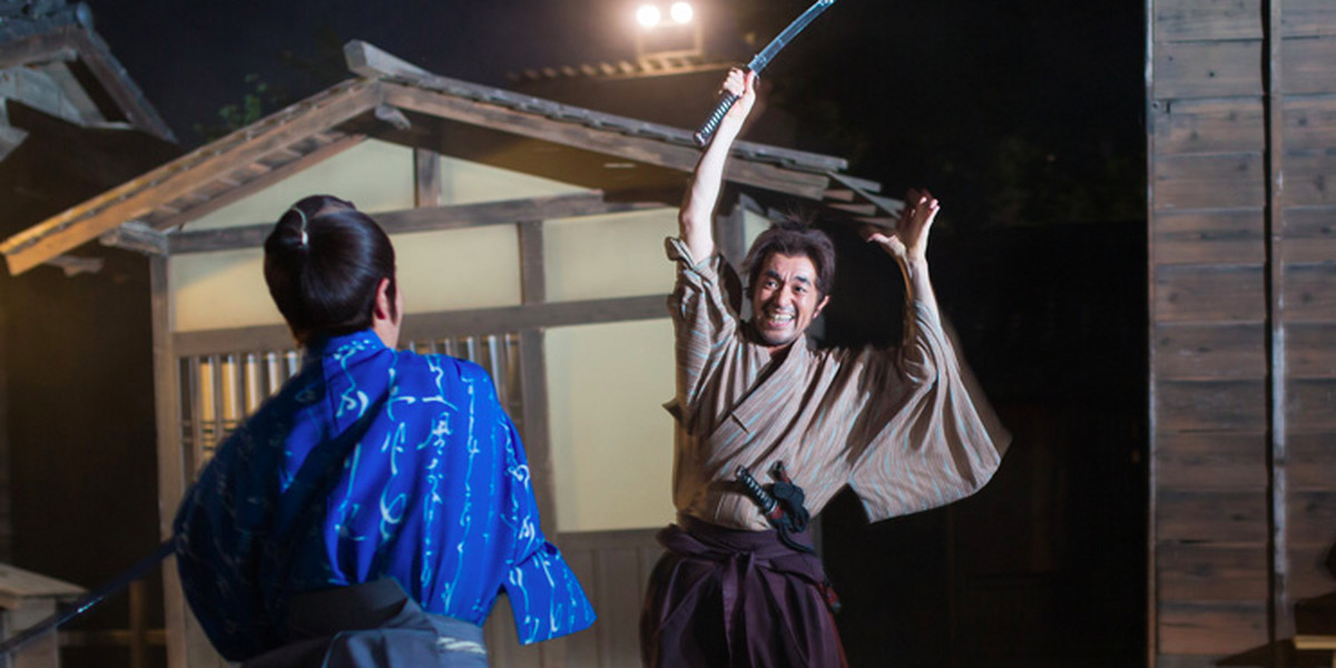 Samurai actors perform sword fights during an event recreating Edo-period Japan.
