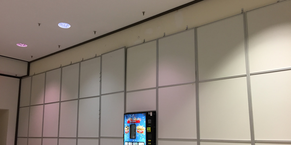 A vending machine and temporary wall cover the former entrance of a shuttered Macy's store in Regency Square Mall in Richmond, Virginia.