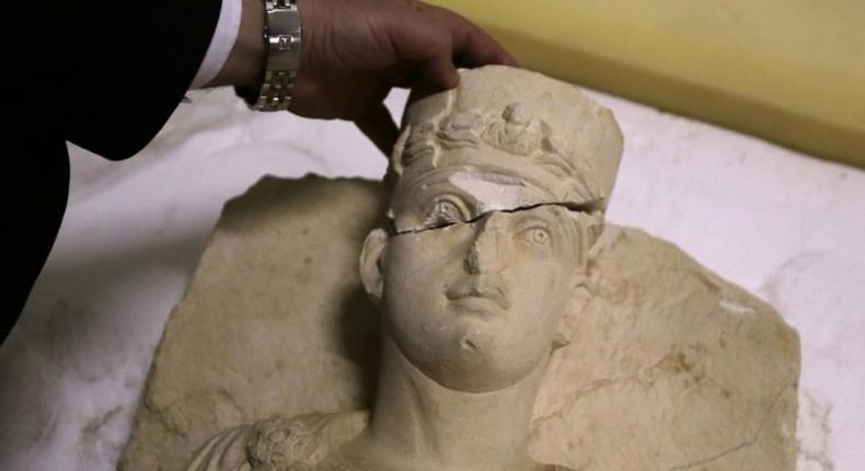 The European Union says it is cracking down on lucrative trade in artefacts looted in war zones such as this rare funeral bust from Palmyra, Syria, estimating illicit trade from crimes against our common cultural heritage at around $6.5 billion