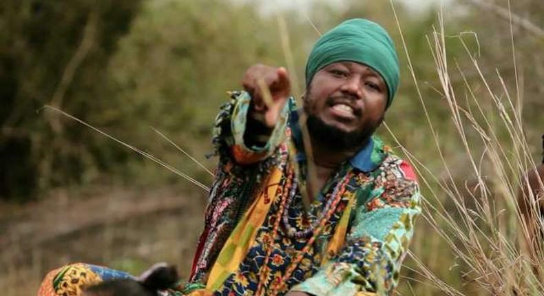 Blakk Rasta dressed in an African print