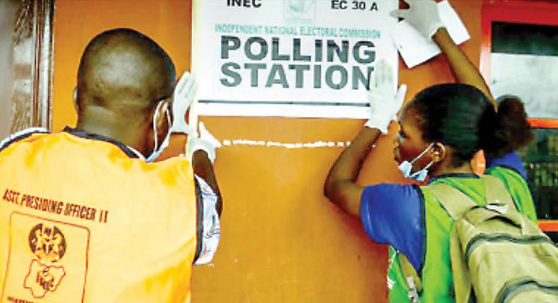 INEC officials at a polling unit. (Tribune)