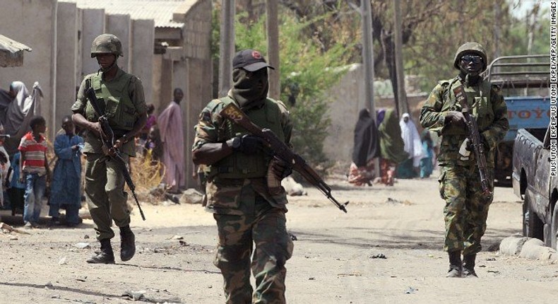 Nigerian soldiers on guard in one of Borno villages.