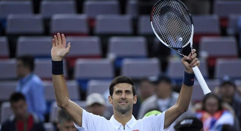 World number one Novak Djokovic celebrates after beating Vasek Pospisil at the Shanghai Masters on October 13, 2016