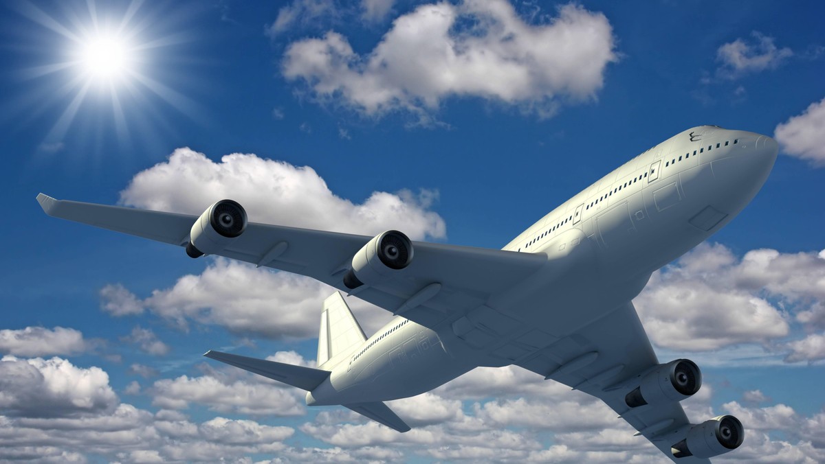 Airplane flying over a blue sky