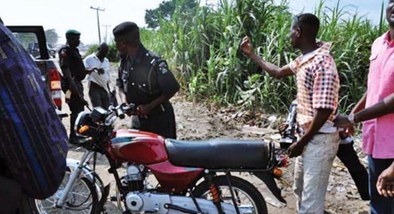 A police officer trying to arrest an erring motorcyclist/Image used for illustrative purpose [asabametro]