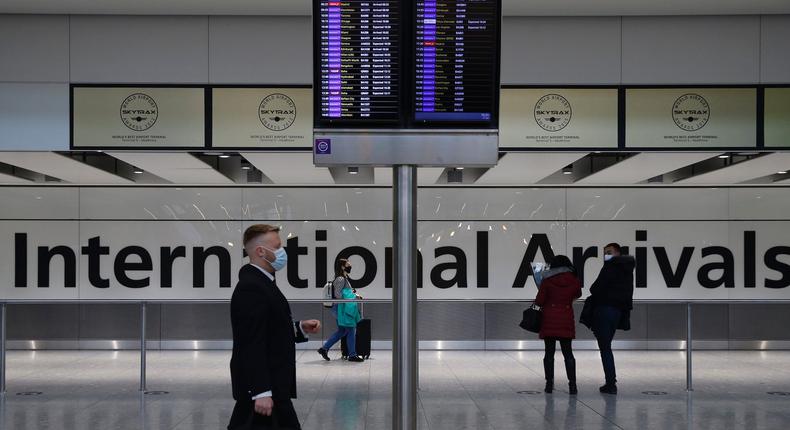 Travelers arrive at Heathrow Airport on January 17, 2021 in London, England.
