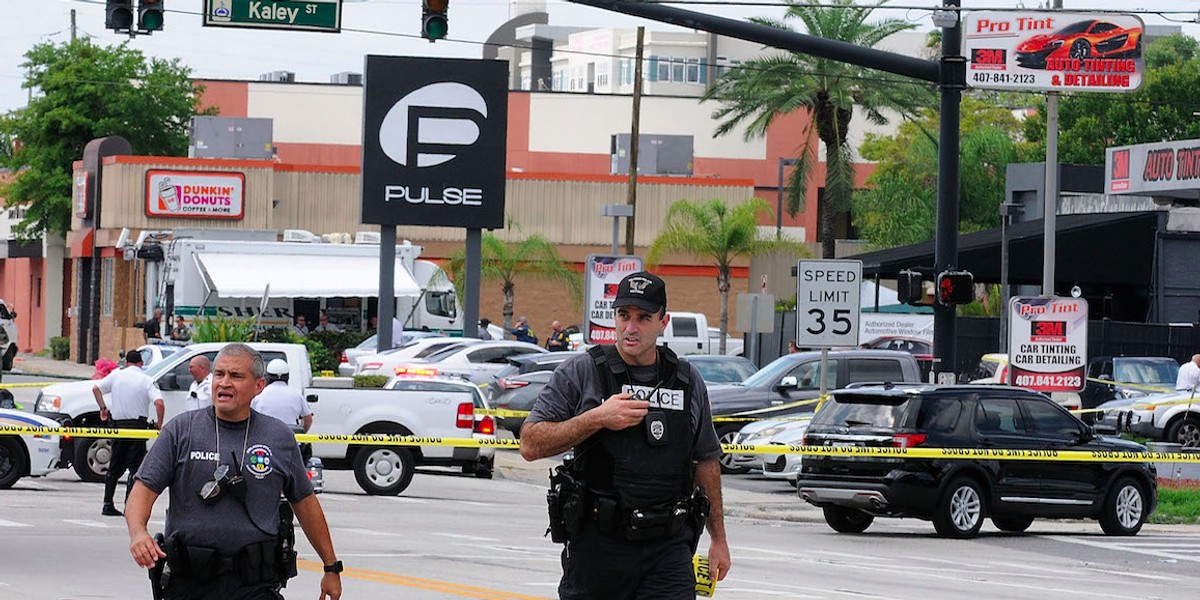 Orlando police officers seen outside of Pulse nightclub after a fatal shooting and hostage situation where 50 people died on June 12, 2016 in Orlando, Florida.