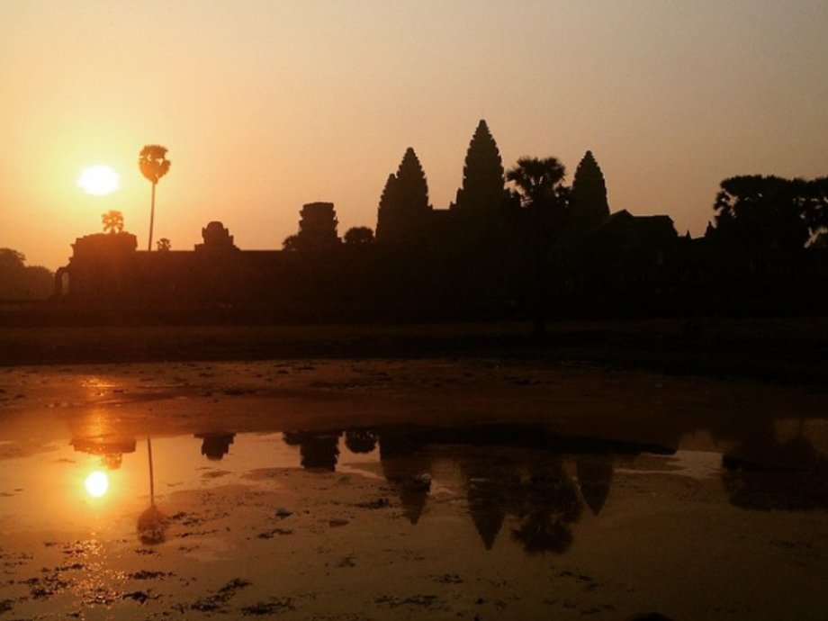 Watching the sunrise in Angkor Wat, Cambodia.