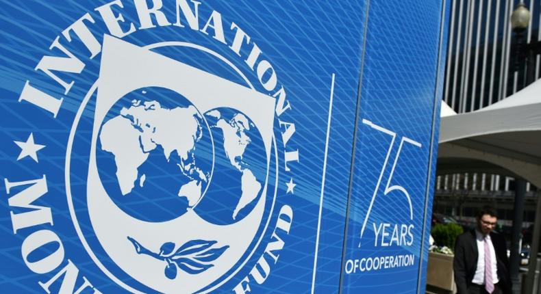 The seal of the International Monetary Fund (IMF) is seen outside of the headquarters building in Washington, DC on April 8, 2019.