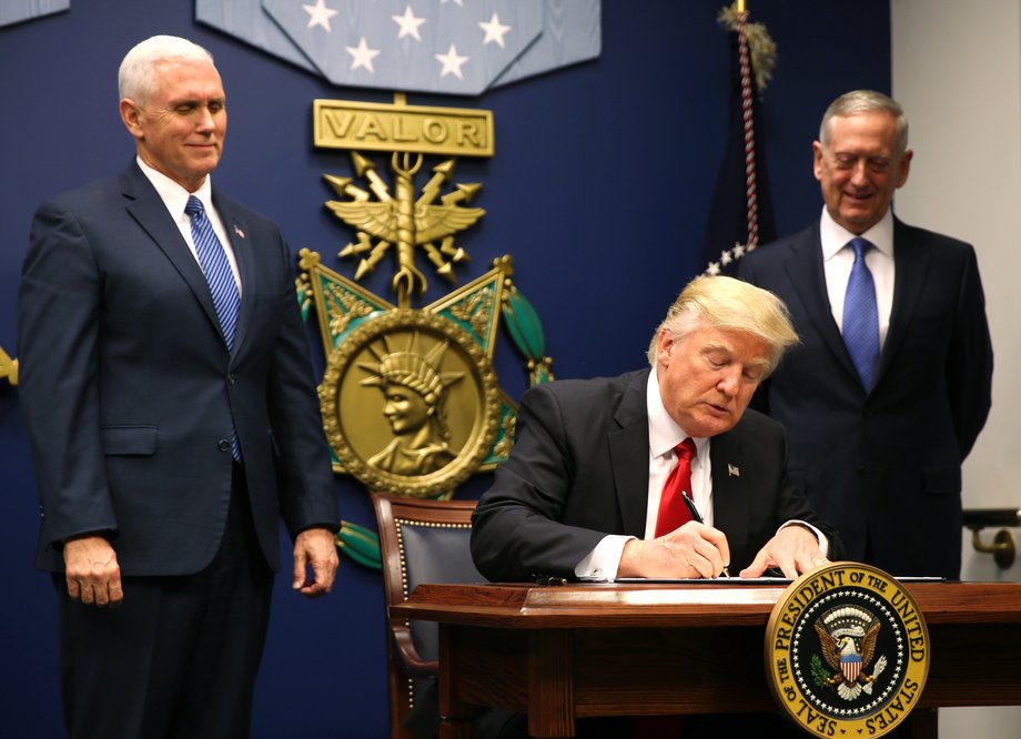 President Donald Trump signs an executive order on January 27, 2017.