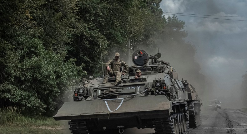 Ukrainian servicemen ride a military vehicle near the Russian border in Ukraine's Sumy region on August 10.REUTERS/Viacheslav Ratynskyi/File Photo