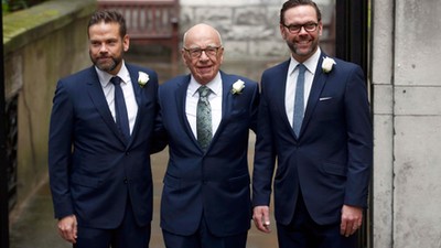 Media Mogul Rupert Murdoch poses for a photograph with his sons Lachlan and James as they arrive at 