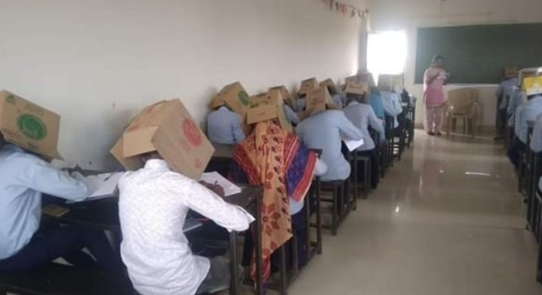 School comes under fire after making students wear boxes to curb cheating. (Twitter)