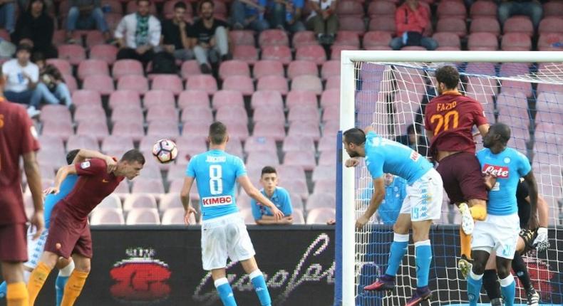 Edin Dzeko (left) scores for Roma against Napoli on October 15, 2016 at the San Paolo stadium in Naples