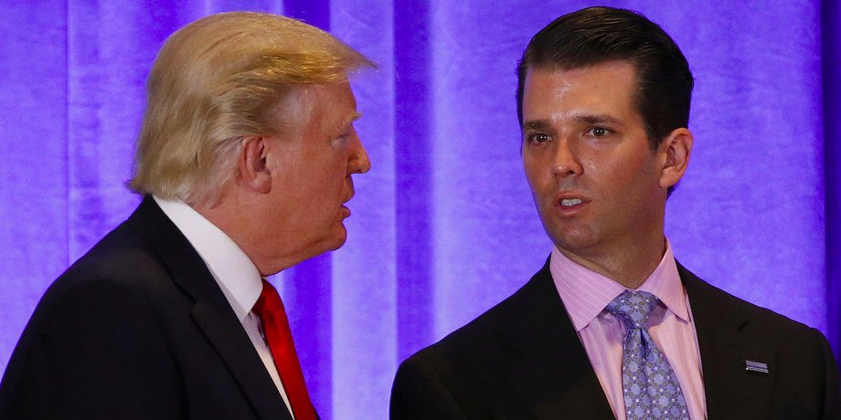 President-elect Donald Trump speaks with his son Donald Trump Jr. during a news conference in the lobby of Trump Tower in New York City, January 11, 2017.