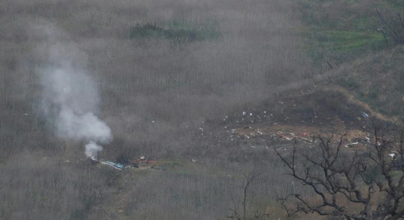 Smoke rises from the site of a helicopter crash in Calabasas, California on January 26, 2020 that killed nine people including NBA legend Kobe Bryant