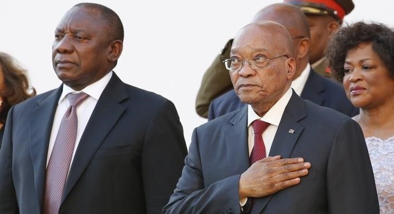 South Africa's Deputy President Cyril Ramaphosa and President Jacob Zuma stand during the playing of the national anthem at the opening of Parliament in Cape Town, in this February 11, 2016 file photo. 