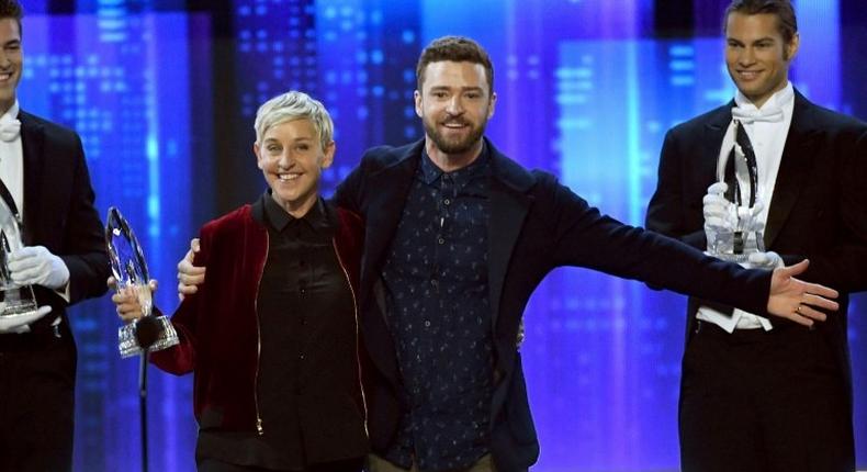 Ellen DeGeneres (L) accepts the award for favorite animated movie voice for 'Finding Dory' during the People's Choice Awards in Los Angeles, California on January 18, 2017