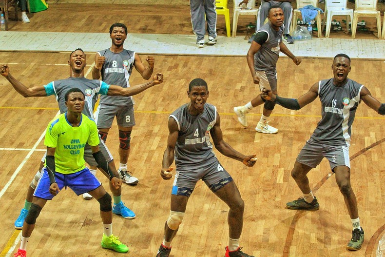 Volleyball players celebrating after a victory