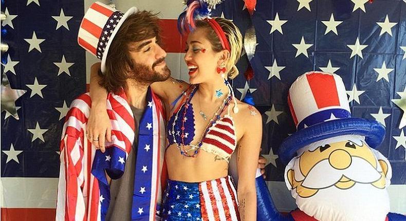 Miley Cyrus and her assistant, Cheyne Thomas celebrating America's Independence