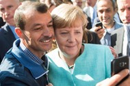 Merkel visits refugee shelter