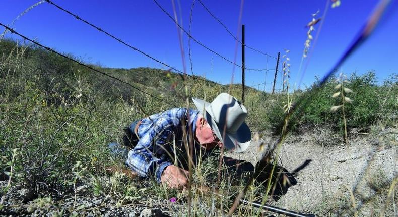 Cattle rancher Jim Chilton demonstrates how easy it is to cross the US-Mexico border on part of his 50,000 acre ranch southeast of Arivaca, Arizona