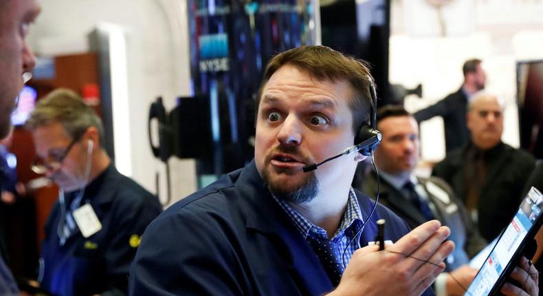 A trader reacts as he works on the floor of the New York Stock Exchange (NYSE) in New York, U.S., March 18, 2020.
