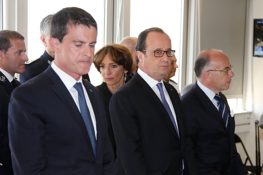 French President Francois Hollande, center, with Prime Minister Manuel Valls, left, and Interior Minister Bernard Cazeneuve before a meeting at the Prefecture the day after the Bastille Day truck attack.