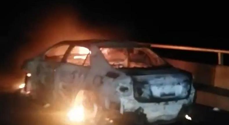The burning sedan car.