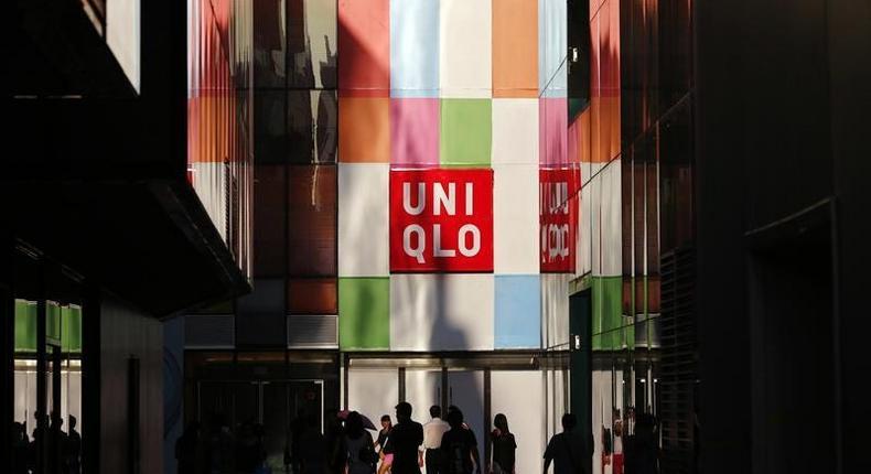 People stand outside a UNIQLO shop in Beijing.Thomson Reuters