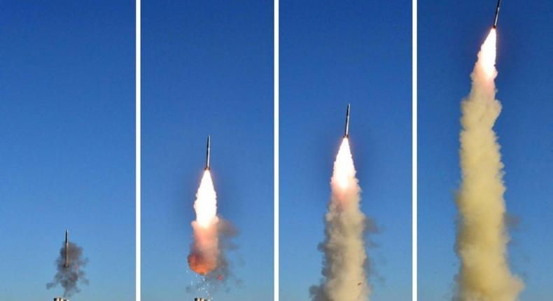 This combo shows undated pictures released from North Korea's official Korean Central News Agency on May 28, 2017 of the test of a new anti-aircraft guided weapon system organized by the Academy of National Defence Science at an undisclosed location