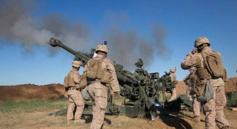 US Marines fire artillery to break up ISIS fighters attacking Kurdish and Peshmerga forces.