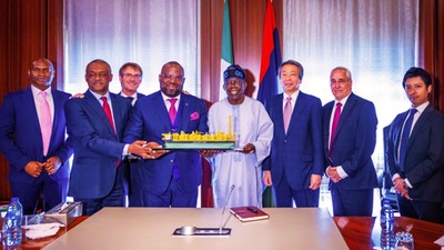 GMD of UTM, Mr Julius Rone, MD of Japan Gas Company and Senior VP of Technip present the prototype of Nigeria's first ever Floating Liquefied Natural Gas (FLNG) facility to President Bola Ahmed Tinubu (GCFR) at the State House. [Presidency]