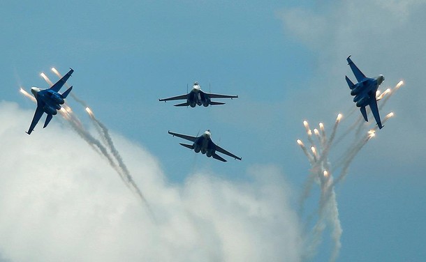 Sukhoi Su-27 jet fighters of Russkiye Vityazi aerobatic team fly in formation during International A