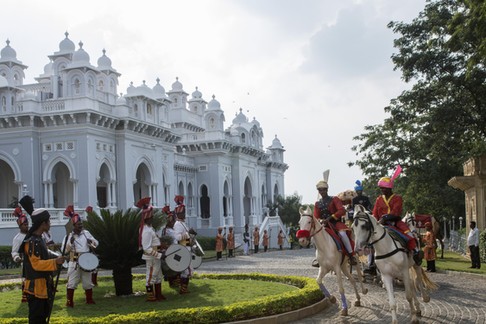 Horses leading a cart with guests arrive at the Taj