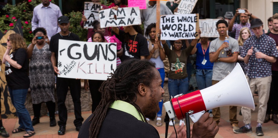 People participate in a rally to protest the death of Walter Scott outside City Hall on April 8, 2015 in North Charleston, South Carolina.
