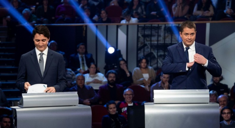 Canada's Prime Minister and Liberal leader Justin Trudeau (L) and Conservative leader Andrew Scheer take part in an election debate on October 10, 2019