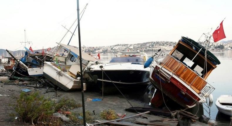 The quake triggered a mini tsunami which damaged boats and vehicles