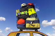 Luggage stacked on car roofrack, low angle view