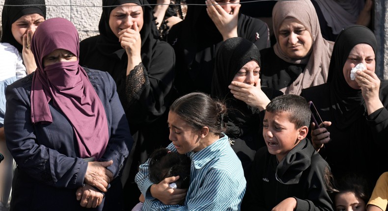 Palestinians cry during the funeral of Rawhi Sawafta, 70, after he was killed by Israeli forces during the raid on the West Bank town of Tubas, Tuesday, Oct. 31, 2023.AP Photo/Majdi Mohammed