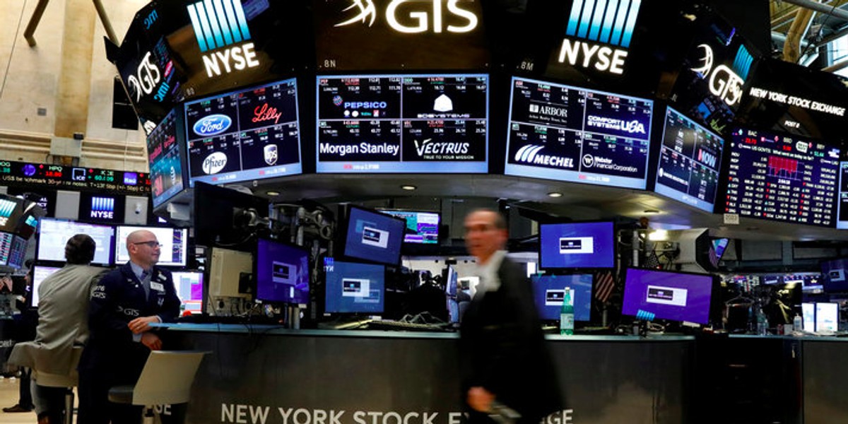 Traders work on the floor of the NYSE in New York