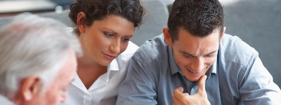 Banking agent explaining an investment scheme to a couple