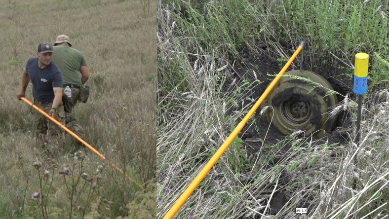 Ryan podnosi minę za pomocą wysięgnika, aby sprawdzić, czy nie ma pod nią granatu