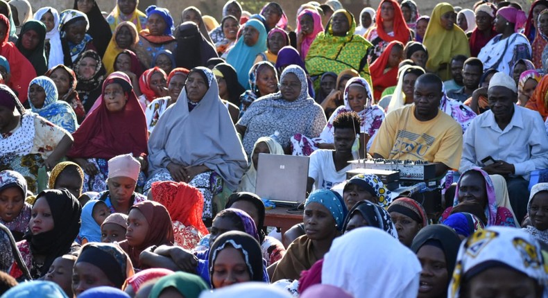 Members of the public crowded without Covid-19 safety precautions during a campaign rally for one of the by-election candidates