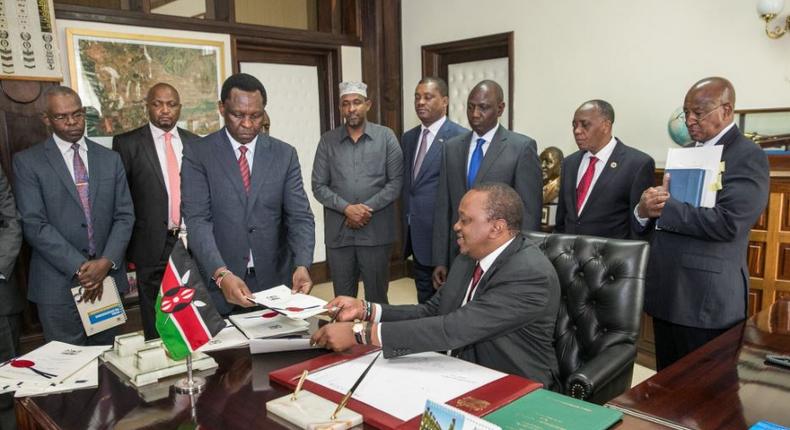 President Uhuru Kenyatta when he signed the Finance Bill 2018 on Friday