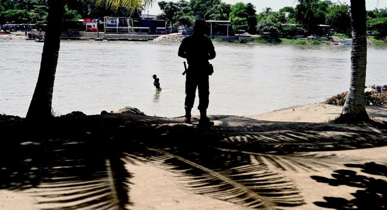 A member of the Mexican National Guard patrols the banks of the Suchiate River in Chiapas State, Mexico, in July 2019 in an effort to prevent illegal migrant crossings