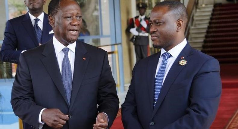 Guillaume Soro, President of Ivory Coast National Assembly talks with Ivory Coast's President Alassane Ouattara (L) at the presidential palace in Abidjan October 24, 2014. REUTERS/Luc Gnago