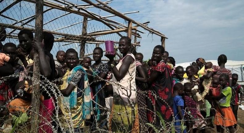 South Sudanese women and children queue to receive emergency food at the United Nations protection of civilians (POC) site 3 hosting about 30,000 people displaced during  fighting in Juba, South Sudan July 25, 2016. REUTERS/Adriane Ohanesian