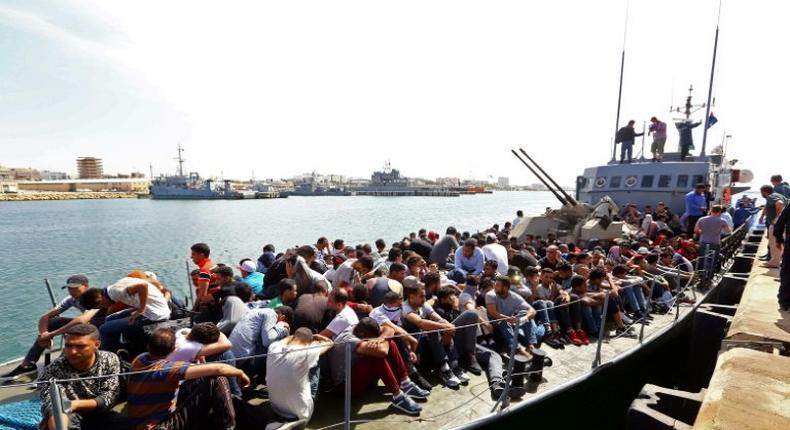 Migrants whose boat was intercepted by the Libyan coastguard in the Mediterranean arrive at a naval base in the capital Tripoli on May 10, 2017