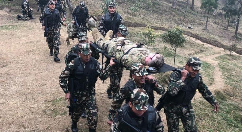 US Army Special Forces soldiers and Nepalese soldiers practice evacuating casualties in Nepal, February 18, 2020.